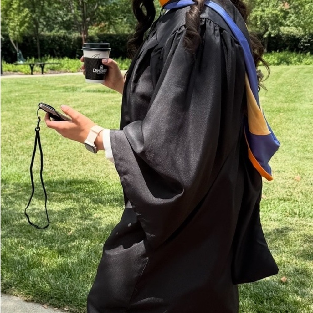 Black Graduation Gown with Blue and MSN Gold Hood and cap with tassel of 2025